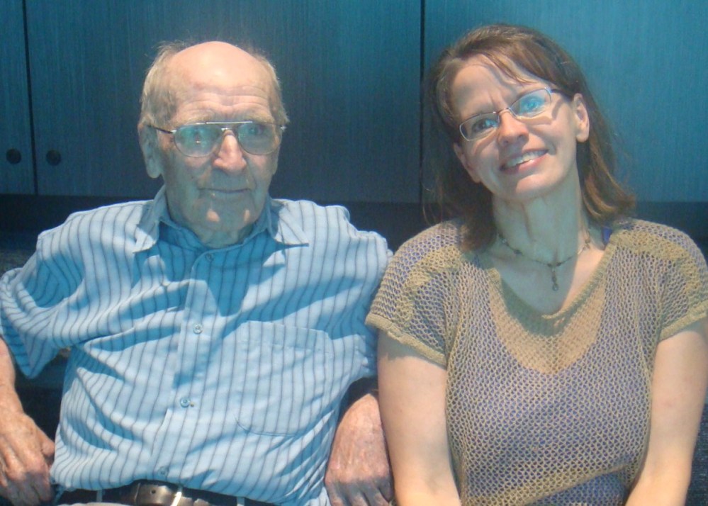 The author and her father on a trip to the zoo.