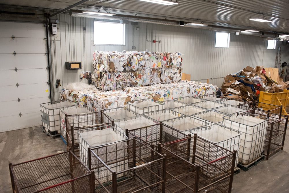 SVJETLANA MLINAREVIC THE CARILLON
Epic/Smile provides work experience for people with intellectual disabilities. Clients assemble spouts for jugs, make picnic tables, or sort recyclables. Here paper products are compacted into square bails and stored in the warehouse.