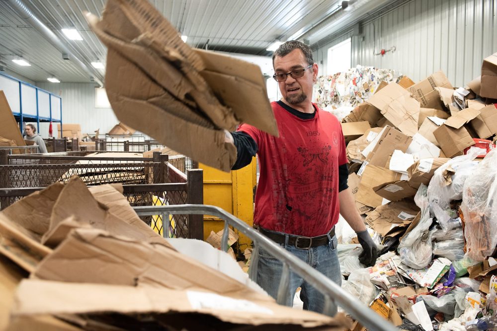 SVJETLANA MLINAREVIC THE CARILLON
Epic/Smile of St. Malo Inc. staff member Patrick Hamonic sorts through paper and cardboard in the organization’s recycling facility. Epic/Smile provides work experience for people with intellectual disabilities, one of the jobs they can do is sort recyclables.