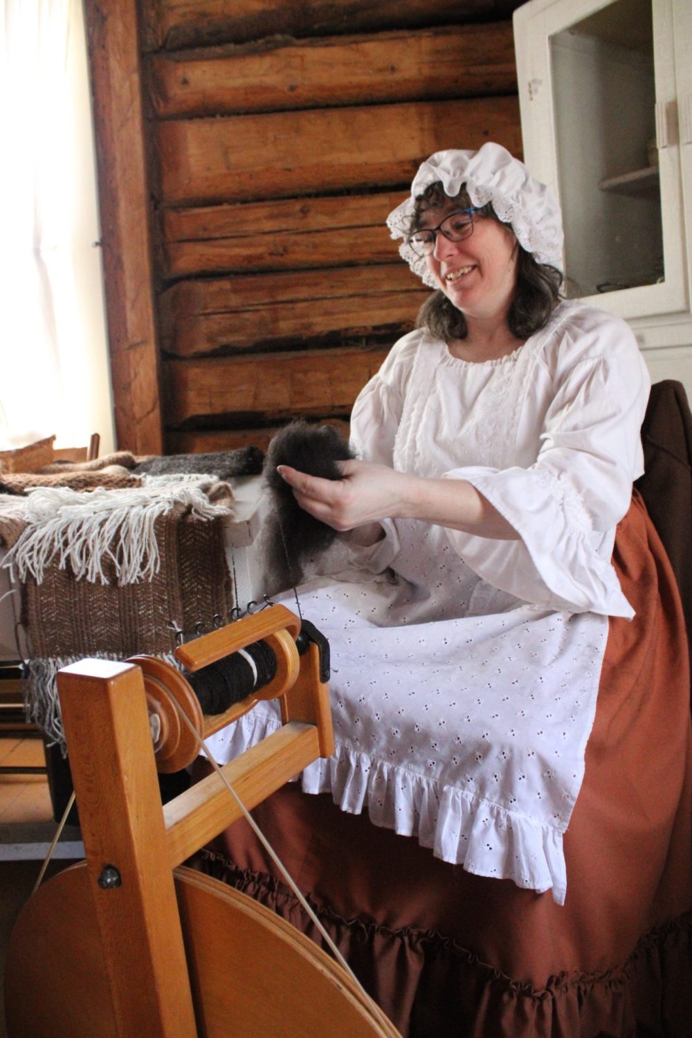 GREG VANDERMEULEN THE CARILLON
Diane Girard spins alpaca wool as she chats with visitors.