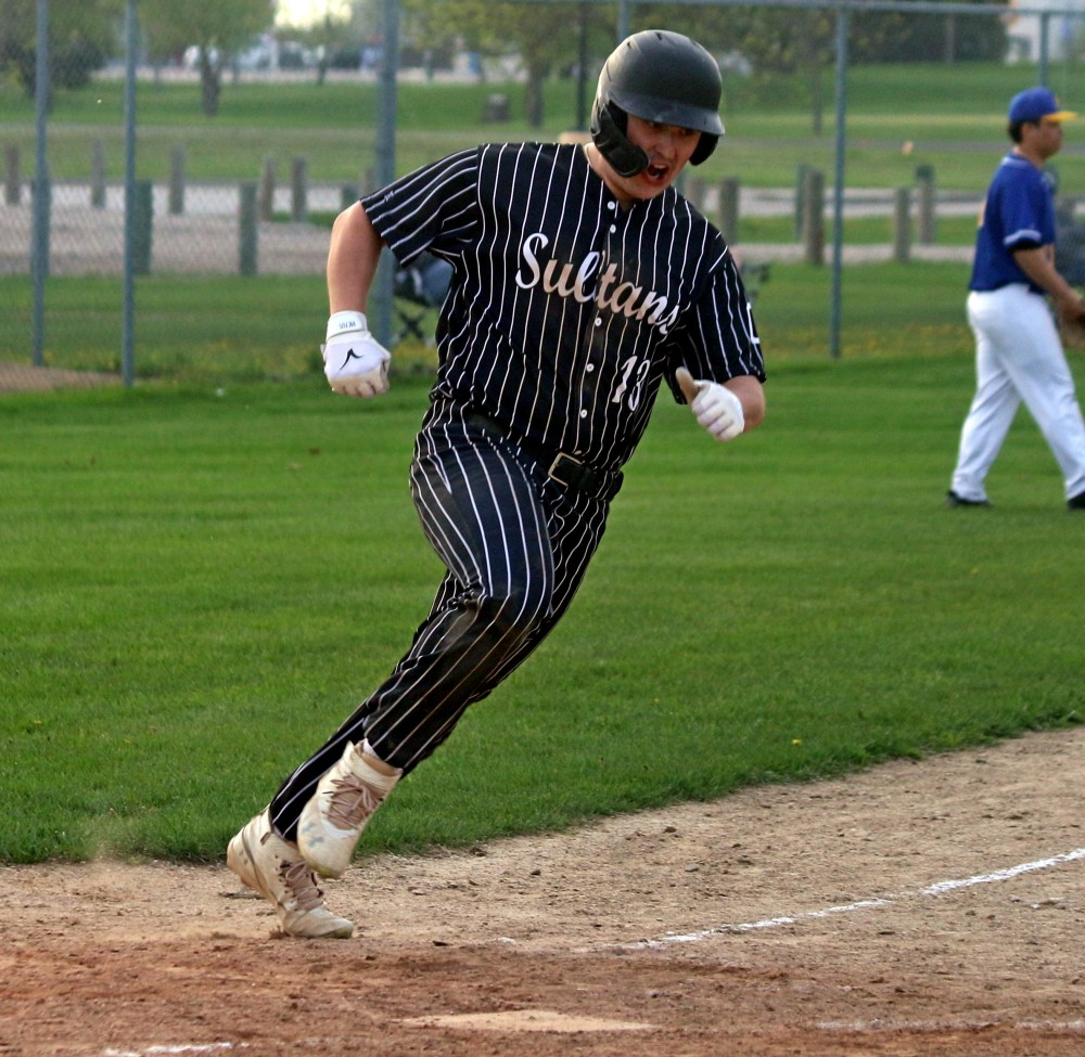 Mason Hartung yells in celebration as he scores the winning run for the Carillon Sultans in the bottom of the seventh during a Manitoba Junior Baseball League game in Steinbach May 20. (Cassidy Dankochik
