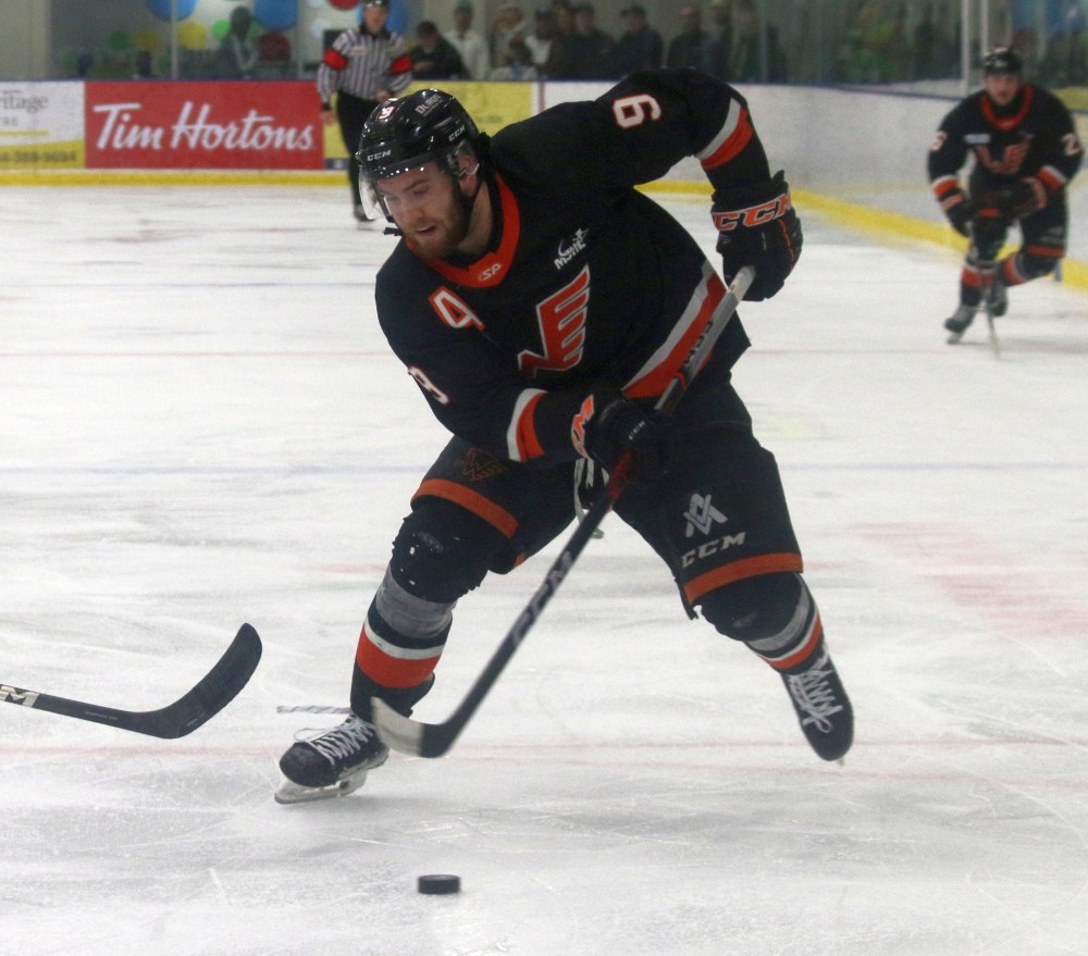 Mike Svenson cuts up ice for the Winkler Flyers during game three of the finals. (Cassidy Dankochik The Carillon)