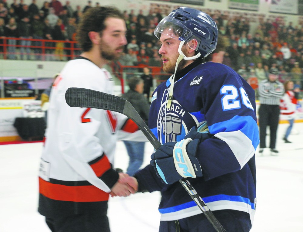 Veteran defenseman Jack Cook lead the post-game handshake line after Steinbach's overtime loss in game four of the Manitoba Junior Hockey League finals in Winkler. (Cassidy Dankochik The Carillon)