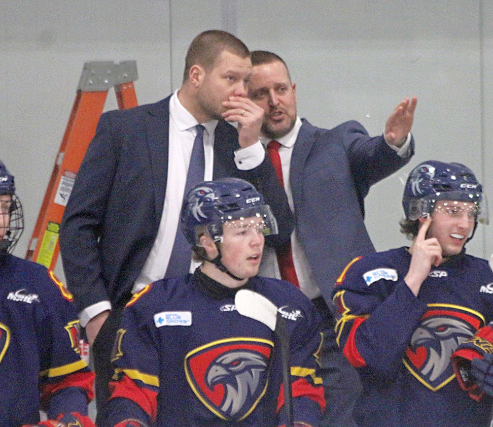 Dwight Hirst (right) stands behind the bench during his first home game as the Niverville Nighthawks head coach. Hirst was hired after the club decided to move on from Kelvin Cech with only 14 games left in the regular season. (Cassidy Dankochik The Carillon)