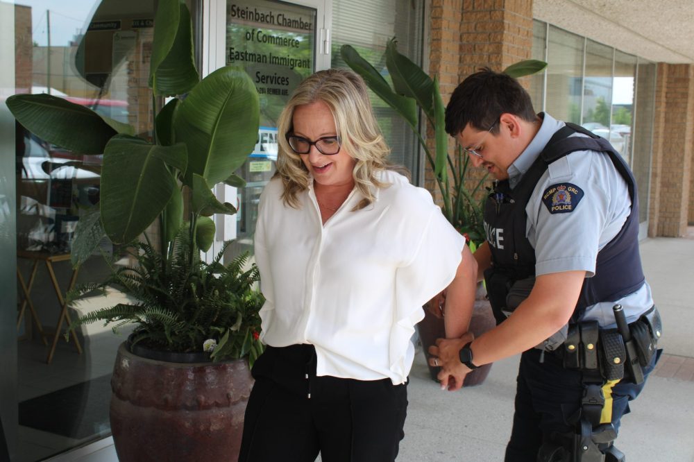 GREG VANDERMEULEN CARILLON ARCHIVES
Steinbach Economic Development Corporation Director Michelle Bezditny was a jail breaker last year, where she was arrested by Cpl. Dennis Redikop.