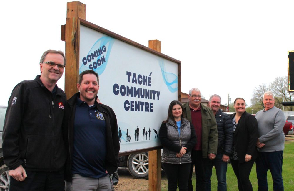 CHRIS GAREAU THE CARILLON
Tache council at the newly erected sign touting the soon-to-come Tache Community Centre in Lorette May 14. The centre is to be the home of a new arena, library and more and is now estimated to cost $29.5 million.
