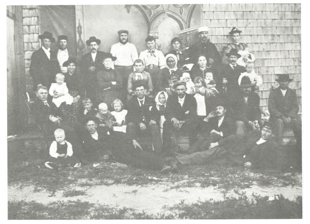 One of the first photographs taken in Steinbach, at the home of Heinrich Wiebe around 1897 by local cheesemaker Peter H. Guenther. Courtesy of Mrs. George Goossen. From Reflections on our Heritage: A History of Steinbach and the R.M. of Hanover from 1874, Abe Warkentin.