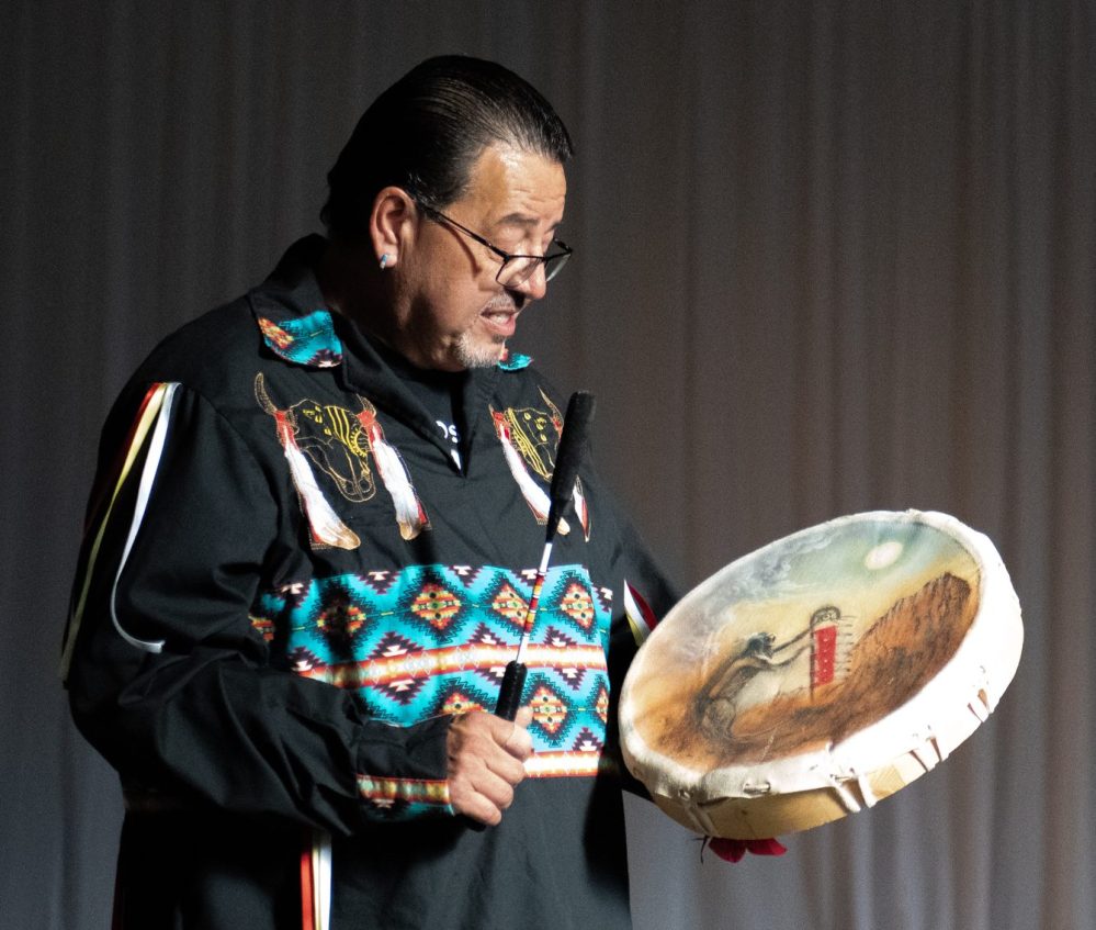 SVJETLANA MLINAREVIC THE CARILLON
Helper Cory Campbell plays the drum and sings a song to a small crowd of about 60 people about welcoming the crowd to learn about Indigenous culture during the Maawanji’iding Ziigwan (Spring Gathering) at Mennonite Heritage Village on May 30, 2024. The event was put on by the Hanover Teachers' Association and MHV to celebrate partnerships with the Indigenous community.