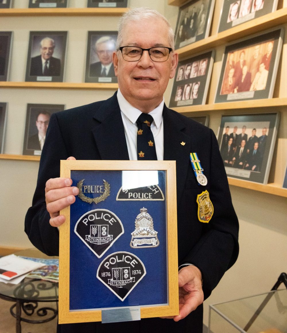 SVJETLANA MLINAREVIC THE CARILLON
Steinbach resident Harry Troche holds a display of three shoulder patches, a hat pin, and a pocket badge he collected from the Steinbach police department, which was in operation from 1922 to 1975. He donated the items to city hall on June 13, 2024.