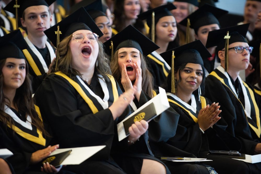 SVJETLANA MLINAREVIC THE CARILLON
Steinbach Regional Secondary School graduates Malika Wiebe (left) and her friend Amelia Wendler cheer on their classmates as they get their diplomas during the graduation ceremony at the RBC Convention Centre on June 25, 2024.