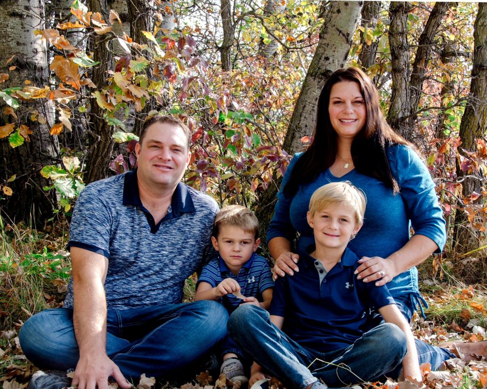HENERVIC FARMS PHOTO
Lyle and Karlee Peters with sons Noah, 8, and Lucas, 4, enjoy a beautiful fall day at the family farm.