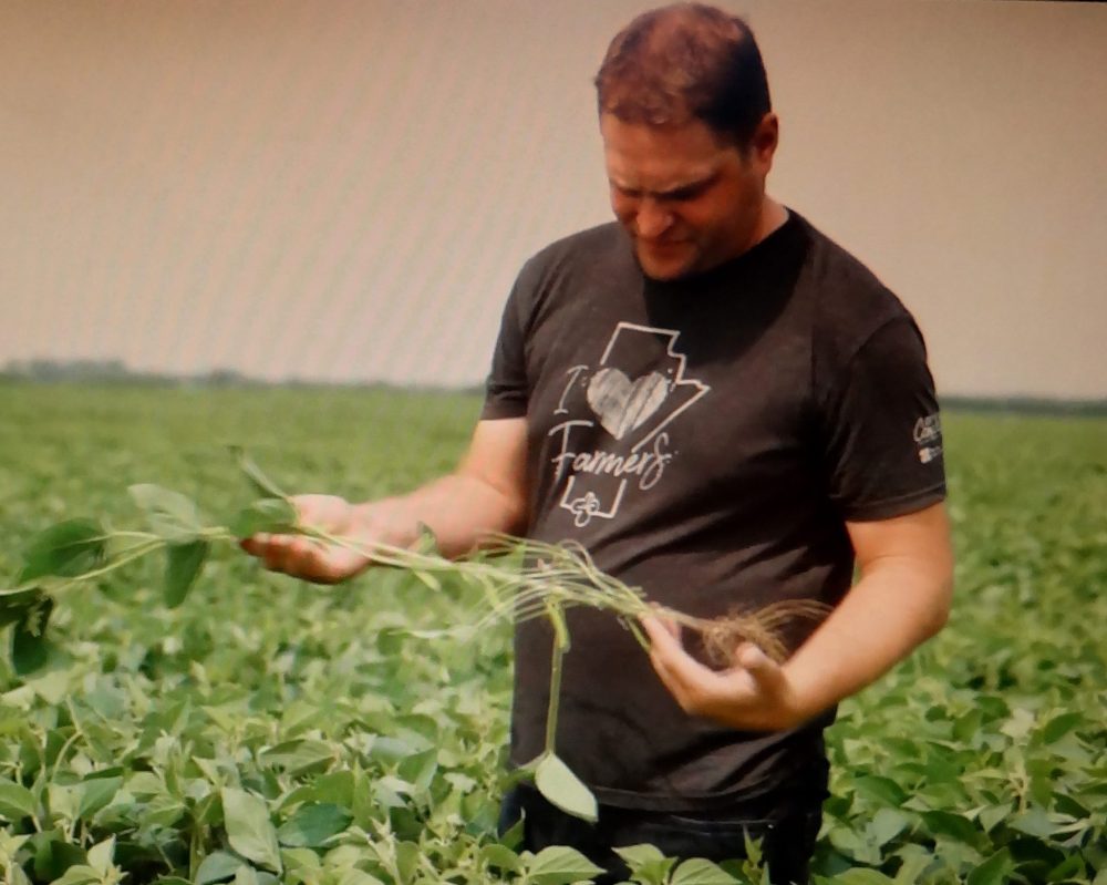 AGRICULTURE IN THE CLASSROOM
Lyle Peters gives elementary school students get a close-up view of a soybean plant during a Follow the Farmer video.