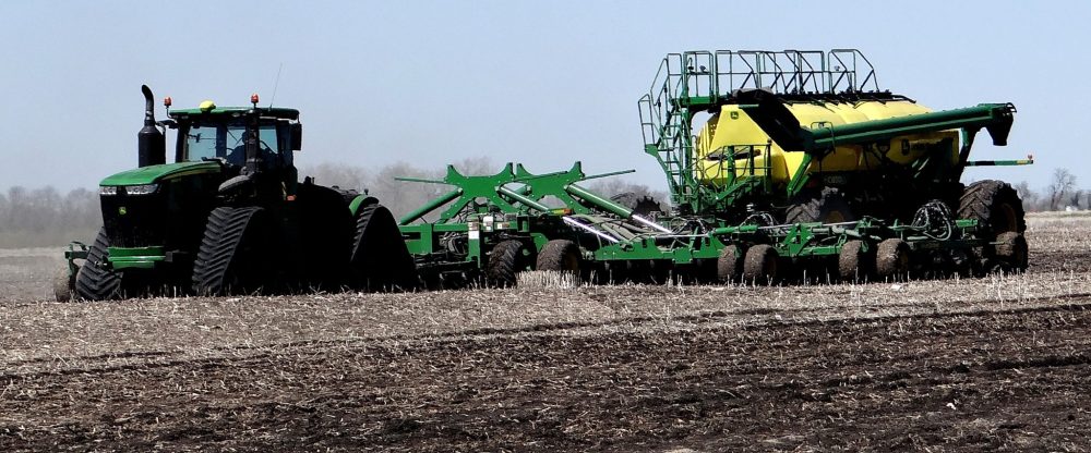 WES KEATING THE CARILLON
A huge four-wheel-drive John Deere tractor on tracks and a 60-foot air-seeder make short work of seeding on a field at Henervic Farms.