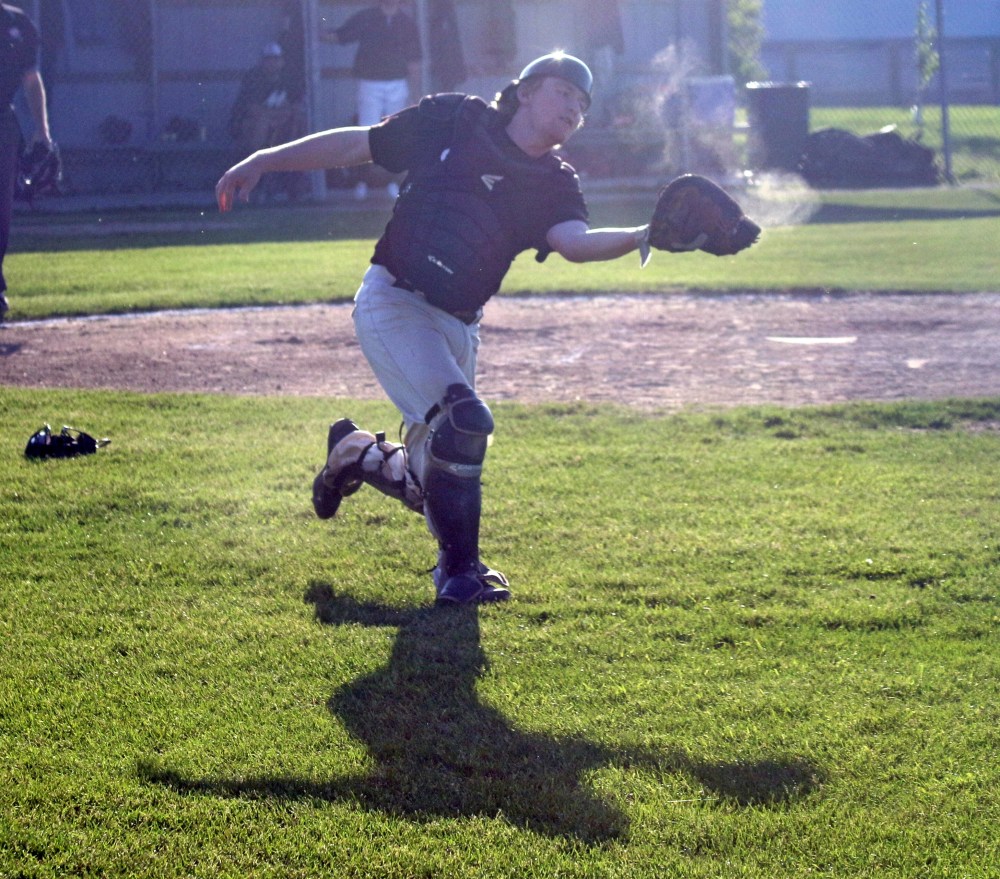 Carillon's catcher was back-lit by the sun as he rushed out into fall territory to make this catch. (Cassidy Dankochik the Carillon)