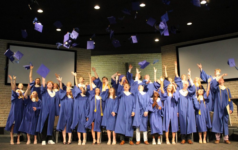 GREG VANDERMEULEN THE CARILLON
SCS grads toss their hats in celebration.