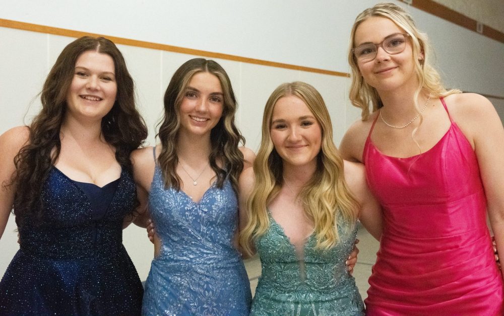 SVJETLANA MLINAREVIC THE CARILLON
Landmark Collegiate graduates Rachel Reimer, Martini Reid, Callie Koop, and Hadyn Kroeker are ready to party in their gowns following their graduation on June 26, 2024, at Prairie Rose Evangelical Mennonite Church.