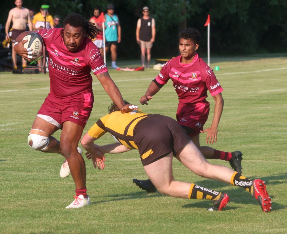 An Eastman player dodges a Wasps tackle while on his way to scoring the opening try of the game during Rugby Manitoba Premier Division action July 11. (Cassidy Dankochik The Carillon)