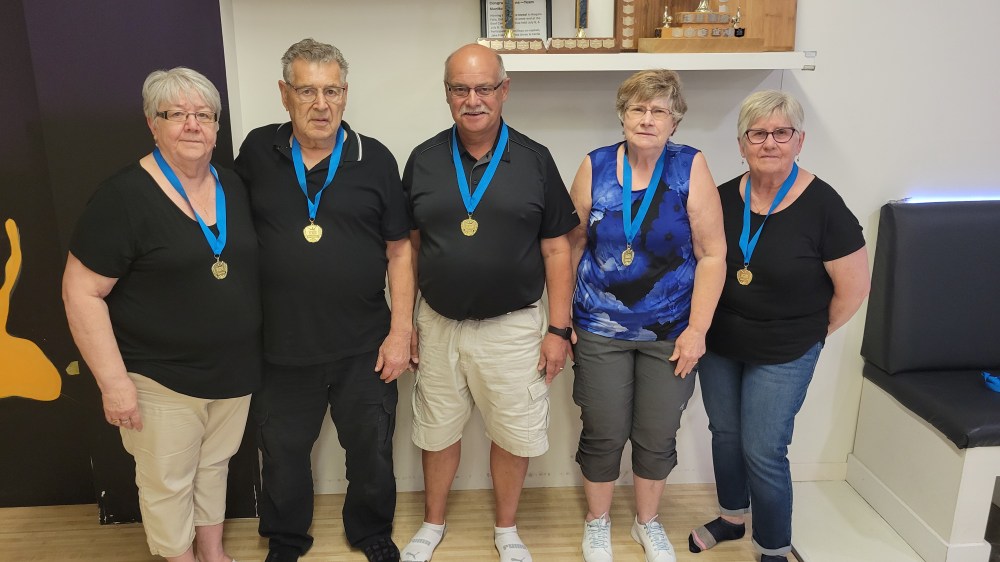 The Steinbach Bowling Alley-based team of Lucy and Richard Choquette, DonEsau, Helena Unrau and Eva Koop won gold medals at the Brandon Manitoba 55+ Games in the 65+ age category. (Cassidy Dankochik The Carillon)