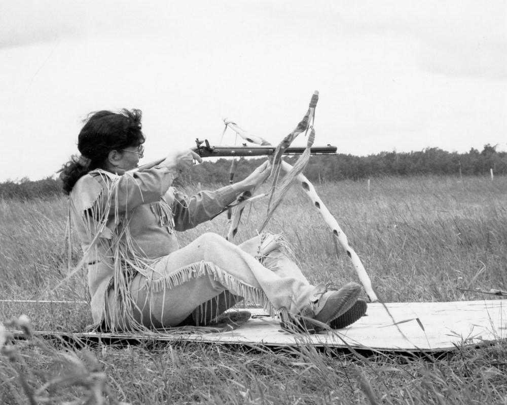 Hazel Steinhauer steadies her musket on a stand made of branches during competition in the 1992 Western Canadian Black Powder Championships, hosted by the Manitoba Muzzle Loaders Association at their target shooting site south of La Broquerie.