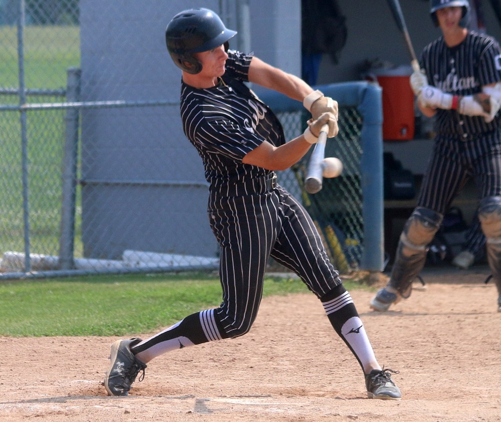 Joe Plett makes contact with a ball during Carillon's game four loss to Elmwood in Winnipeg July 28. (Cassidy Dankochik The Carillon)