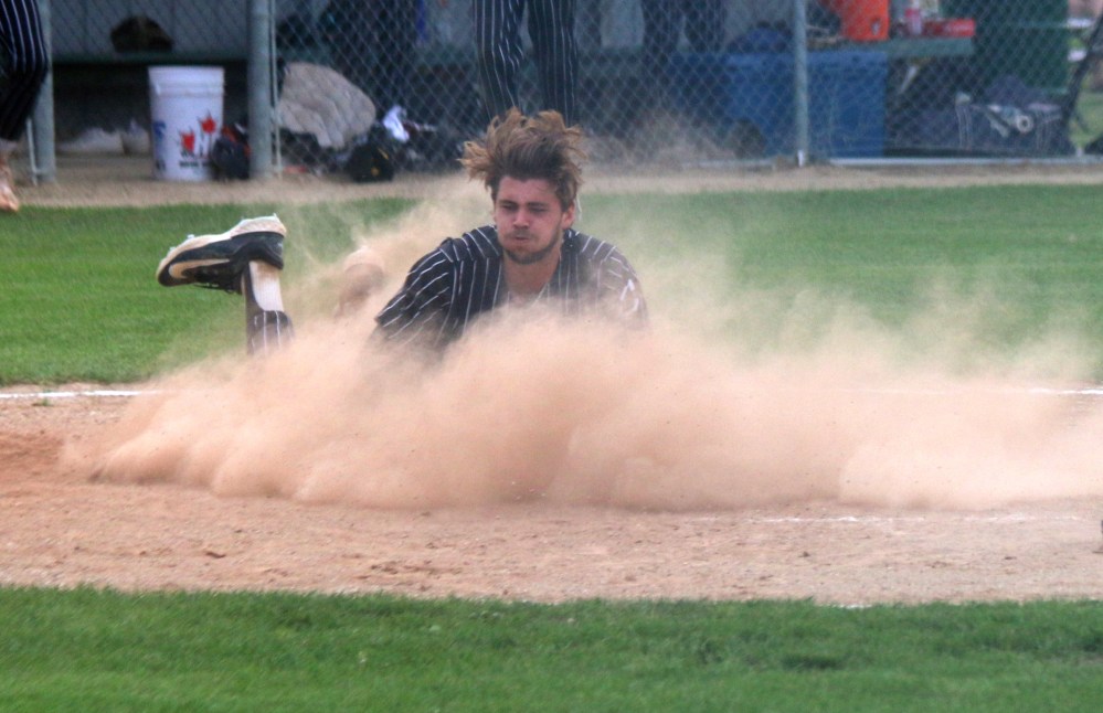 Rylan Penner had the hottest bat in either lineup during the first three games of the MJBL finals, including a 4/4 night in game two. He followed that up with a 3/4 performance in game three July 26 in A.D. Penner Park, including this slide home to score a run. (Cassidy Dankochik The Carillon)