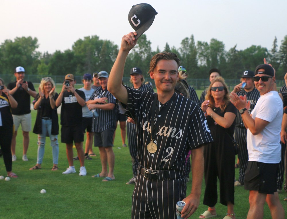Pitcher/infielder Cedric Lagasse tips his cap to the crowd after he was named the Manitoba Junior Baseball League's playoff MVP. He boasted a 4-0 record, and was the winning pitcher in the winner-takes-all game five in the final. (Cassidy Dankochik The Carillon)