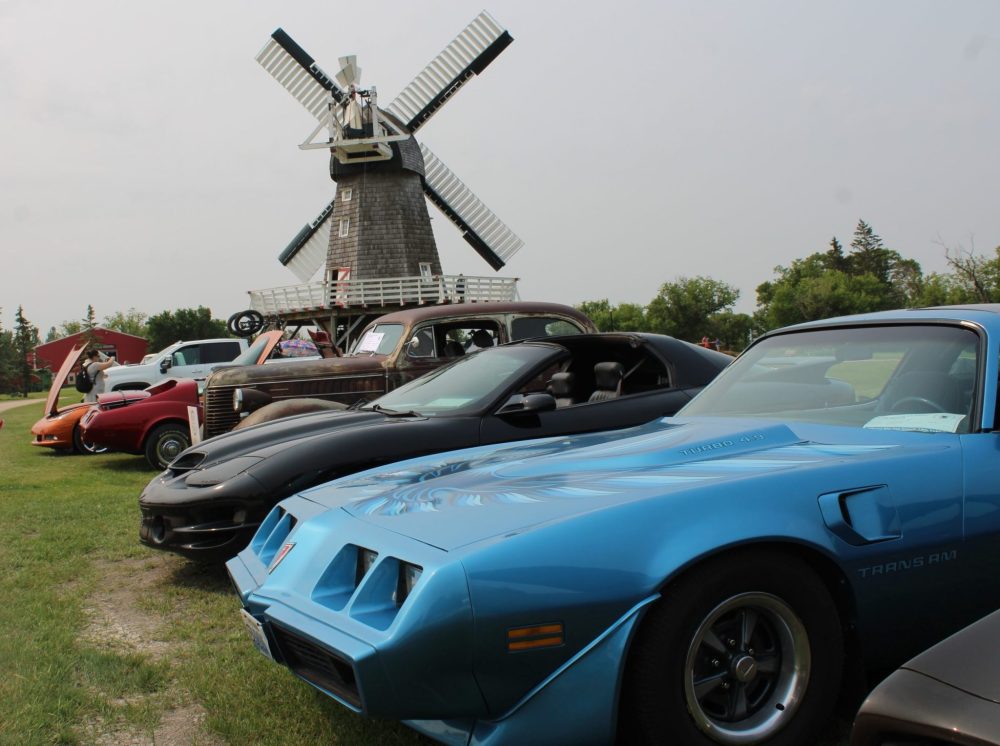 GREG VANDERMEULEN THE CARILLON
The famous windmill at the Mennonite Heritage Village was the backdrop for some of the vehicles at the annual show.