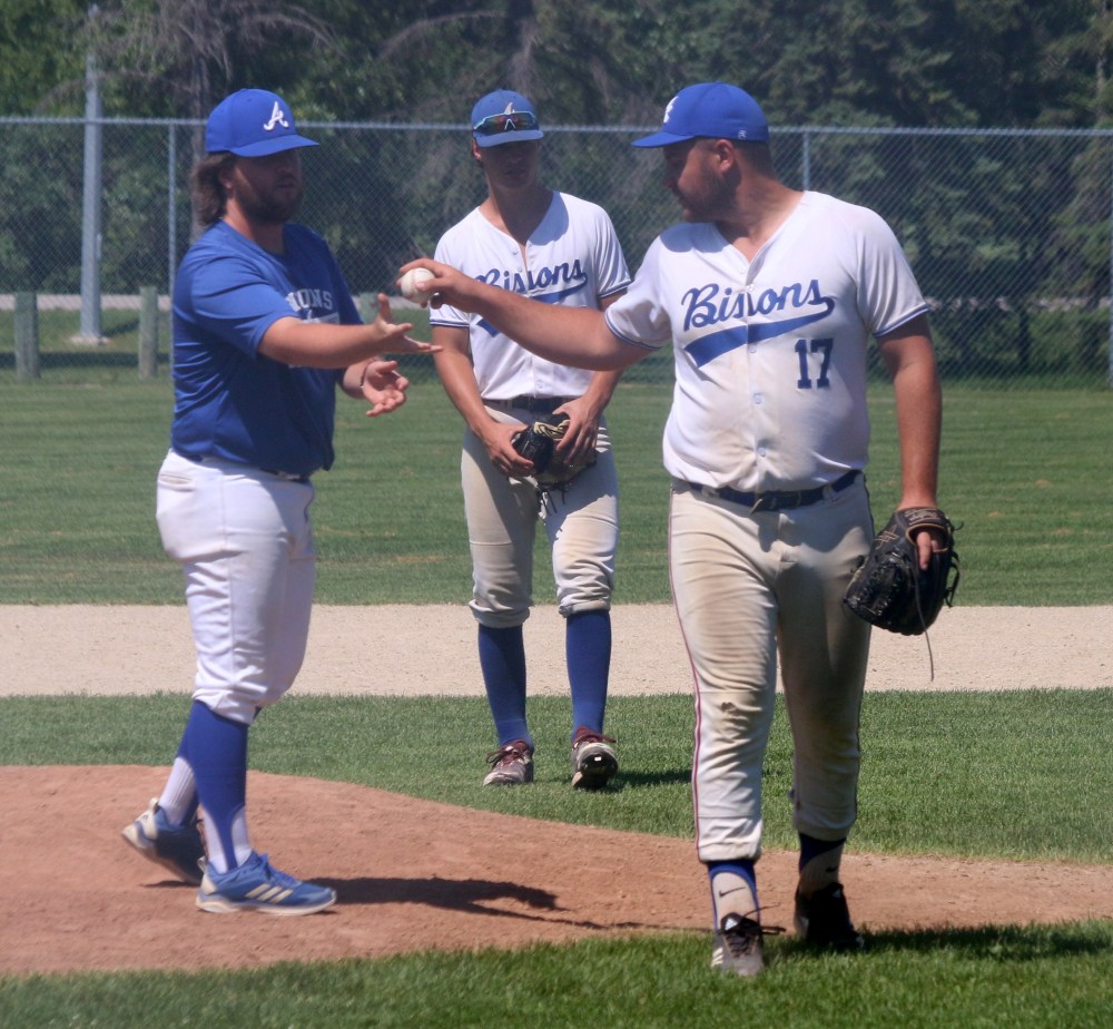 Maddox Mateychuk hands over the baseball for the final time in an Altona Bisons jersey during game two of the MJBL quarterfinals. The Dominion City player is aging out of the junior system this year. (Cassidy Dankochik The Carillon)