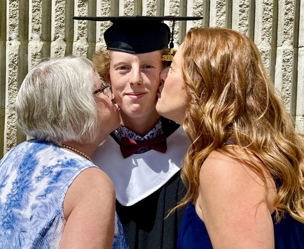 LORI PENNER THE CARILLON
Hayden Peters receives a congratulatory kiss from his mother and grandmother.