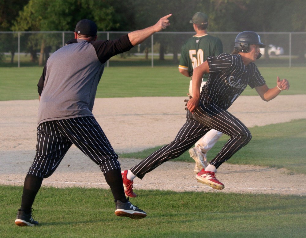Ryan Powers gets the signal to go home and score what was a walk-off run for Carillon in game one of the MJBL semis. Powers' run gave the Sultans a 10-run lead in the fifth inning, which is enough for the game to be called in the MJBL. (Cassidy Dankochik The Carillon)