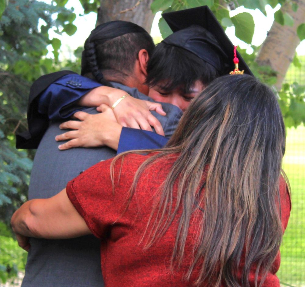 CHRIS GAREAU THE CARILLON
Families embraced their kids who aren’t kids anymore after the Ste Anne Collegiate convocation ceremony at Transcona Country Club June 26.