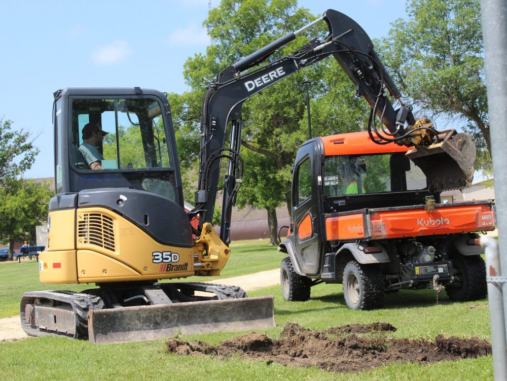 CHRIS GAREAU THE CARILLON
Room is made for new stone benches last Friday in St Pierre’s Parc Carillon as families make use of the splash pad built as part of the Village’s park master plan. New cornhole equipment and trees were also being added this summer.