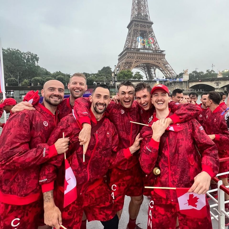 Eric Loeppky and some of his Team Canada men's volleyball teammates stand underneath the Eiffel Tower during the Paris Olympics opening ceremonies. (Eric Loeppky Instagram)