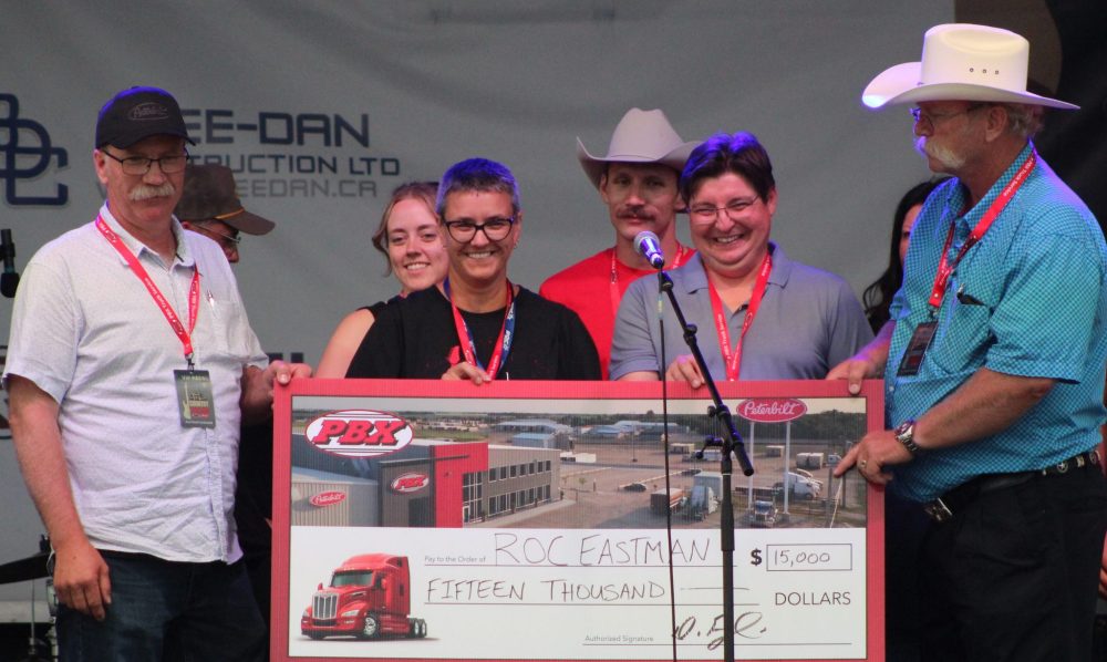 CHRIS GAREAU THE CARILLON
ROC Eastman accepts their cheque.
