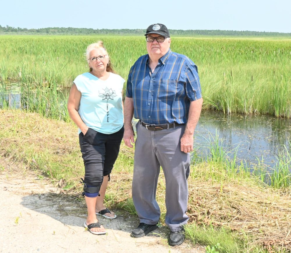 ALEX LAMBERT THE CARILLON
Stuartburn Reeve Michelle Gawronsky and Piney Reeve Wayne Anderson stand next to what used to be farmland, but has recently turned into a waterlogged unusable piece of land.