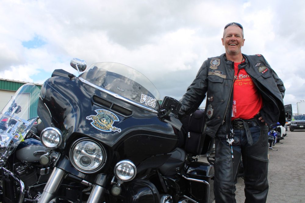 GREG VANDERMEULEN THE CARILLON
Mark Goldade, chief operating officer of The Rolling Barrage, stands beside his bike.