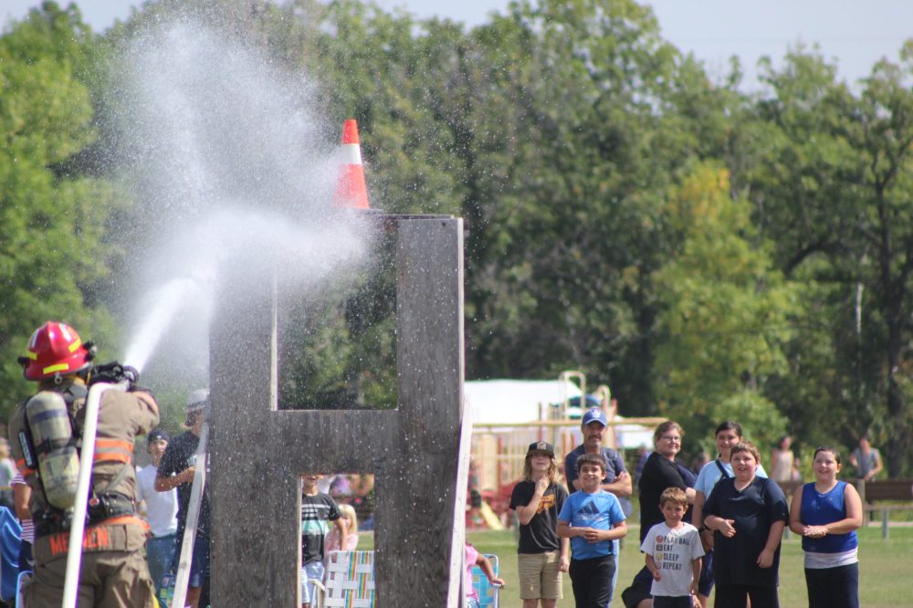 CHRIS GAREAU CARILLON ARCHIVES
Kids get a chance to stay cool during the Cornerstone Firefighter Challenge at Kleefeld Honey Festival.