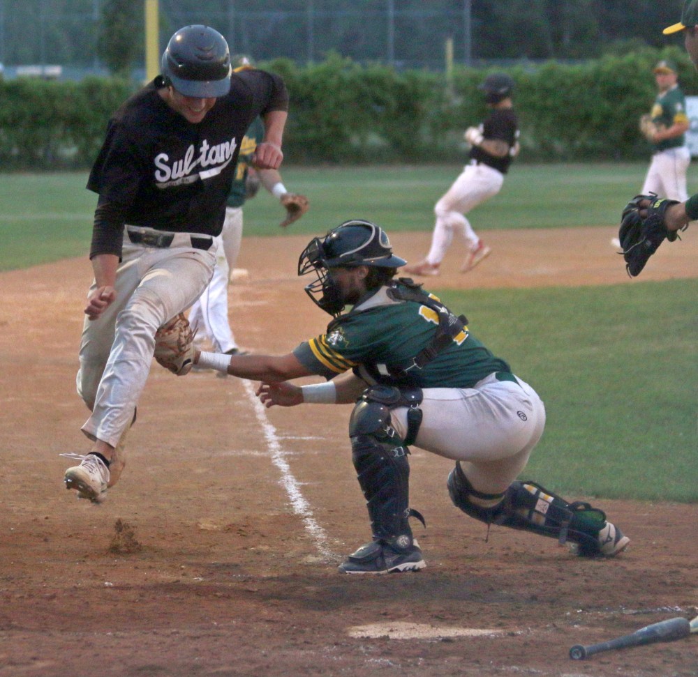 A Carillon runner is tagged out while trying to reach home during his team's 9-8 loss to West Winnipeg in the Winnipeg Senior Baseball League finals. (Cassidy Dankochik The Carillon)