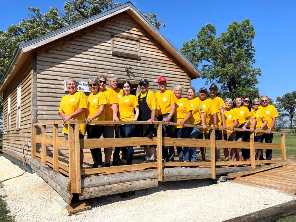 LORI PENNER THE CARILLON
Members of the Post Road Heritage Group gather on the newly constructed ramp at the Officers Mess building. From left: Rita Wiebe, Charlotte Johnston, Jean Mackie, Wally Empson, Shelby Graham, Doug Johnston, Dick Remus, Marlyn Empson (chair), Dale Buhler, Jamie Buhler, Ben Wiebe, Dawna Knutt, Ashley Pettit, Lori Ihme, and David Wiebe. .