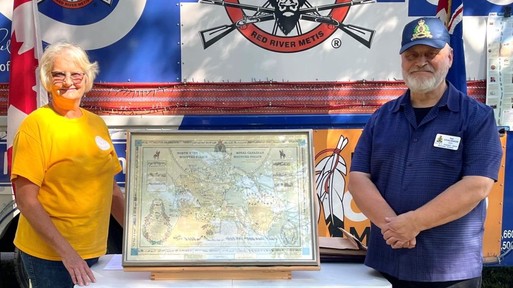 LORI PENNER THE CARILLON
Post Road Heritage Group chair Marlyn Empson received a Northwest Mounted Police map from retired RCMP officer Allan Schaldemose.