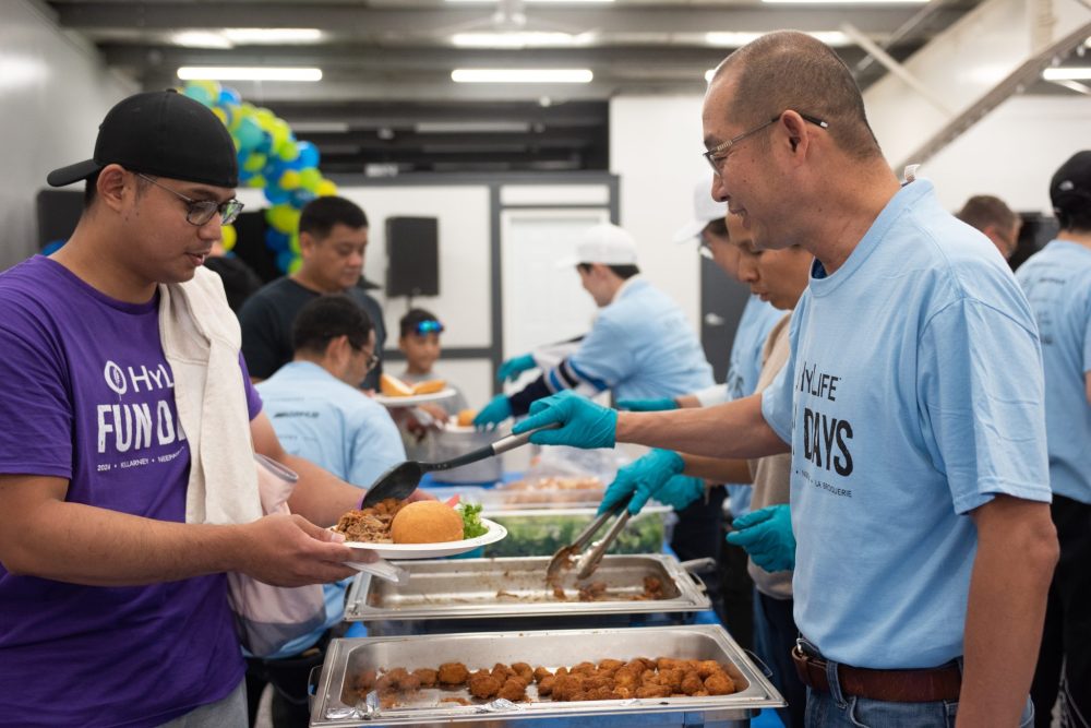 SVJETLANA MLINAREVIC THE CARILLON
HyLife president and CEO Karan Sangfai serves an employee lunch during HyLife Fun Day at the HyLife Centre in La Broquerie on Sept. 14, 2024.