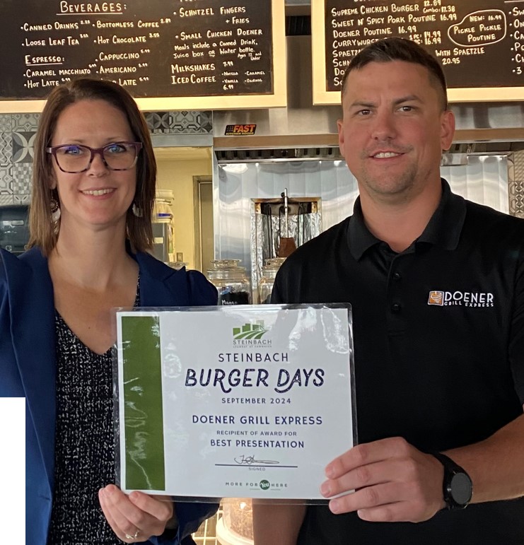 SUPPLIED
Doug Penner of Doener Grill Express accepts the award for best presentation from Steinbach Chamber of Commerce executive director Tessa Masi.