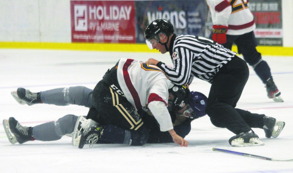 Nolan Kelly and Aiden Corbett dropped the gloves for a fight in the third period of the Niverville Nighthawks' blue vs white game. (Cassidy Dankochik The Carillon)