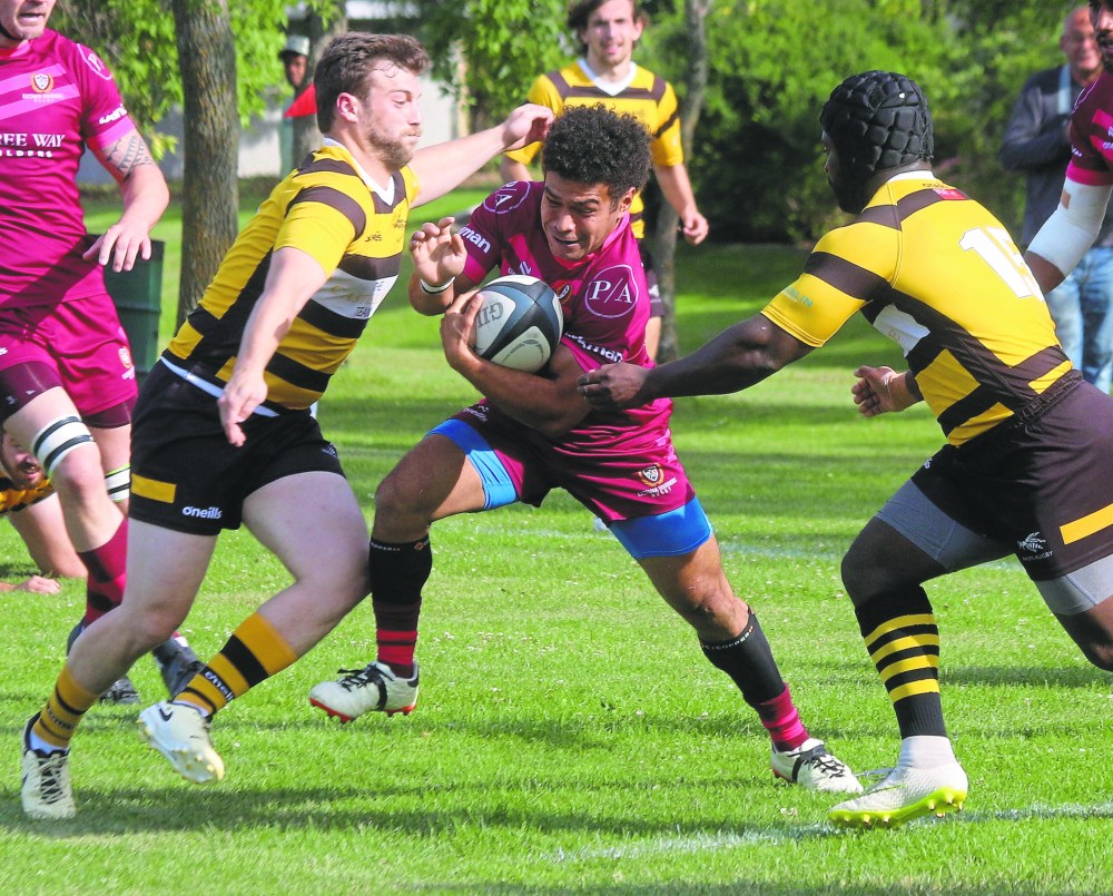 An Eastman Warriors player weaves through traffic during the semi-final match. (Cassidy Dankochik The Carillon)