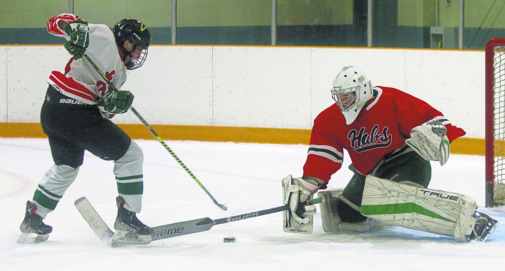 An aspiring La Broquerie Habs goalie goes for a poke check during the team's final scrimmage of their open tryouts, hosted at the T.G. Smith Centre in Steinbach Sept. 7. (Cassidy Dankochik The Carillon)