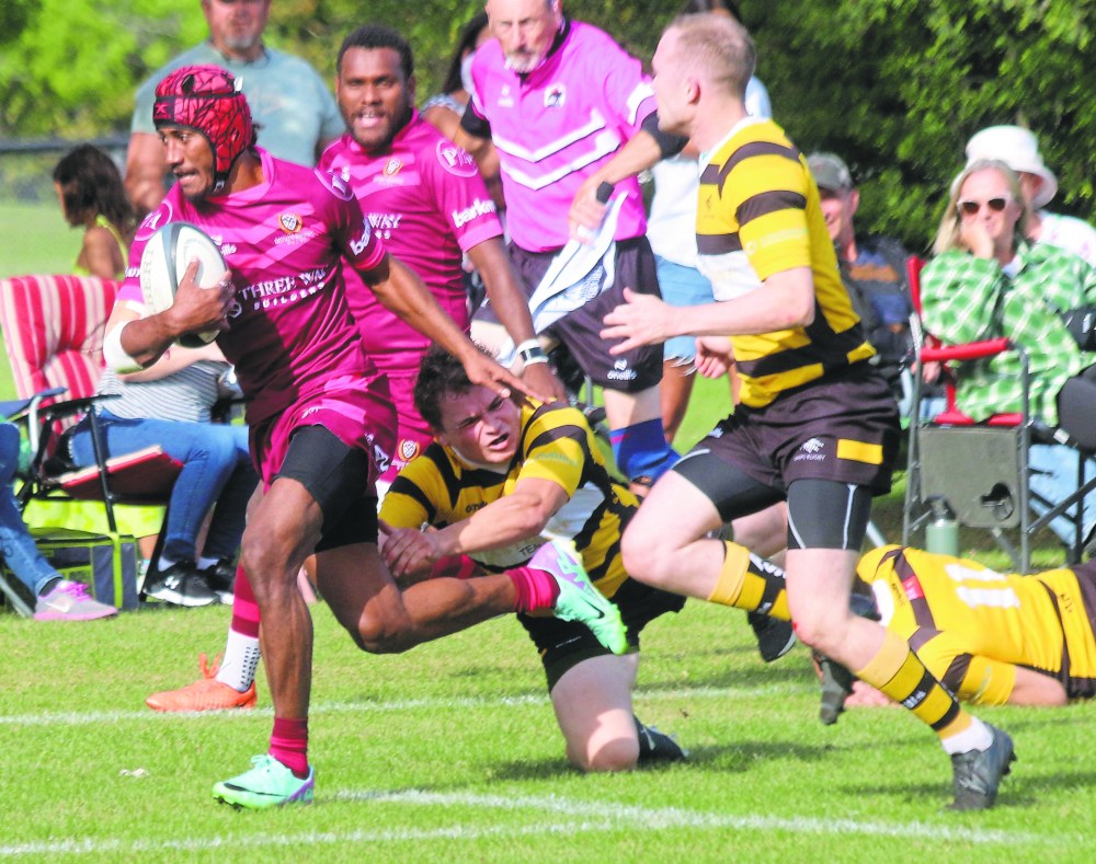 An Eastman Warriors player romps through Wasps tacklers for a first-half try during the team's 45-5 victory over the Winnipeg Wasps in the Manitoba Rugby Premier Division semi-finals, hosted at A.D. Penner Park Sept. 7. (Cassidy Dankochik The Carillon)