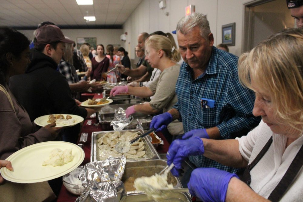 GREG VANDERMEULEN THE CARILLON
Gladys and Edward Michaniuk and Larysa Oher started the process with perogies, mashed potatoes and meatballs.