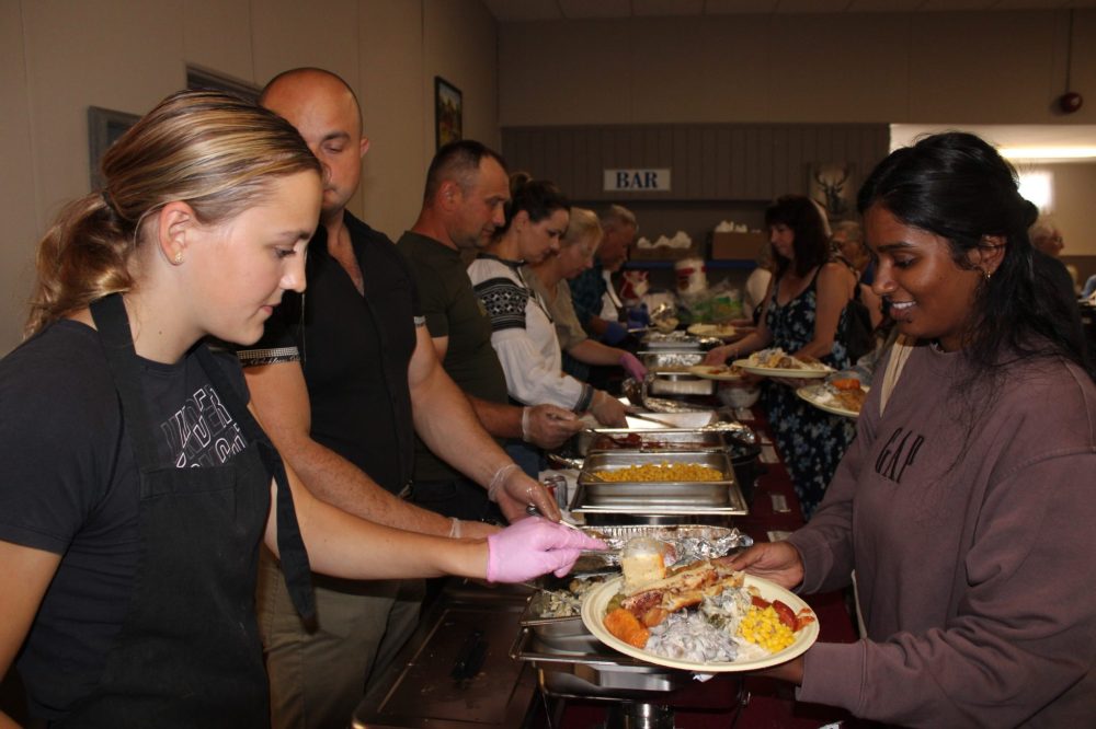 GREG VANDERMEULEN THE CARILLON
Hailey Germain adds to an already overflowing plate as Pansy kicked off the fall supper season on Sunday.