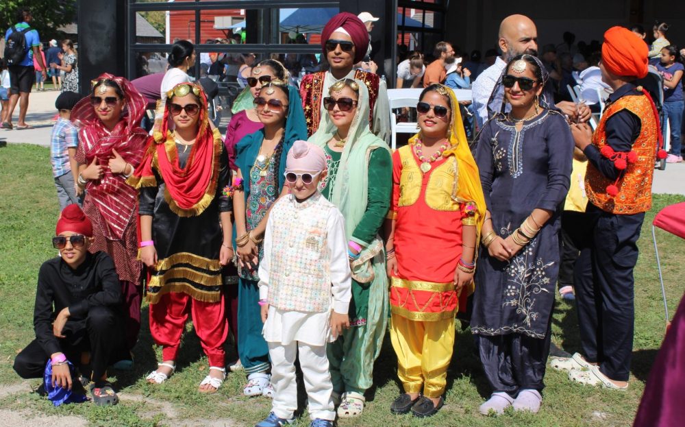 GREG VANDERMEULEN THE CARILLON
The Punjabi Folk Dance group takes time to pose after their performance.