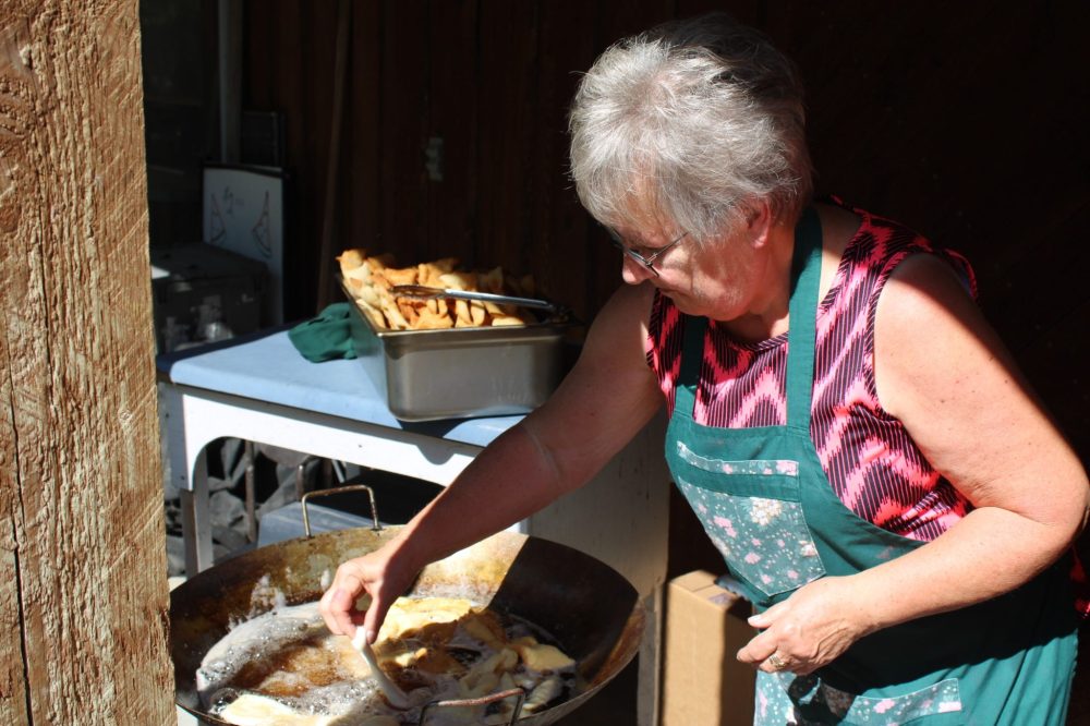 GREG VANDERMEULEN THE CARILLON
Trudie Kehler cooks rollkuchen during the event.